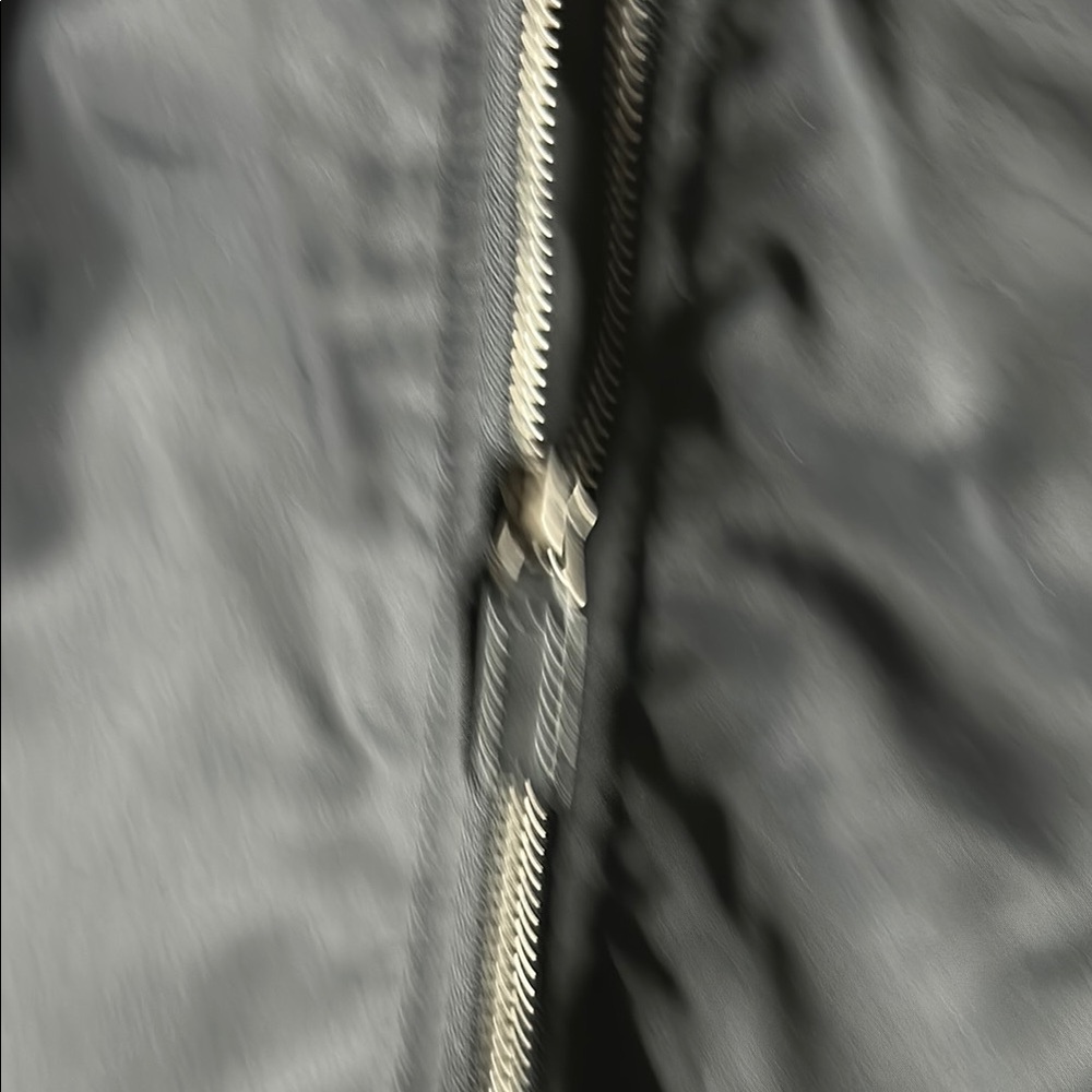 Black Puffer Jacket with Ribbed Cuffs and Water-Resistant Finish - Picture 3 of 7